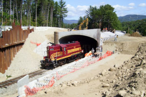 Photo of a train running through a tunnel under construction on US 302 in Bartlett, NH